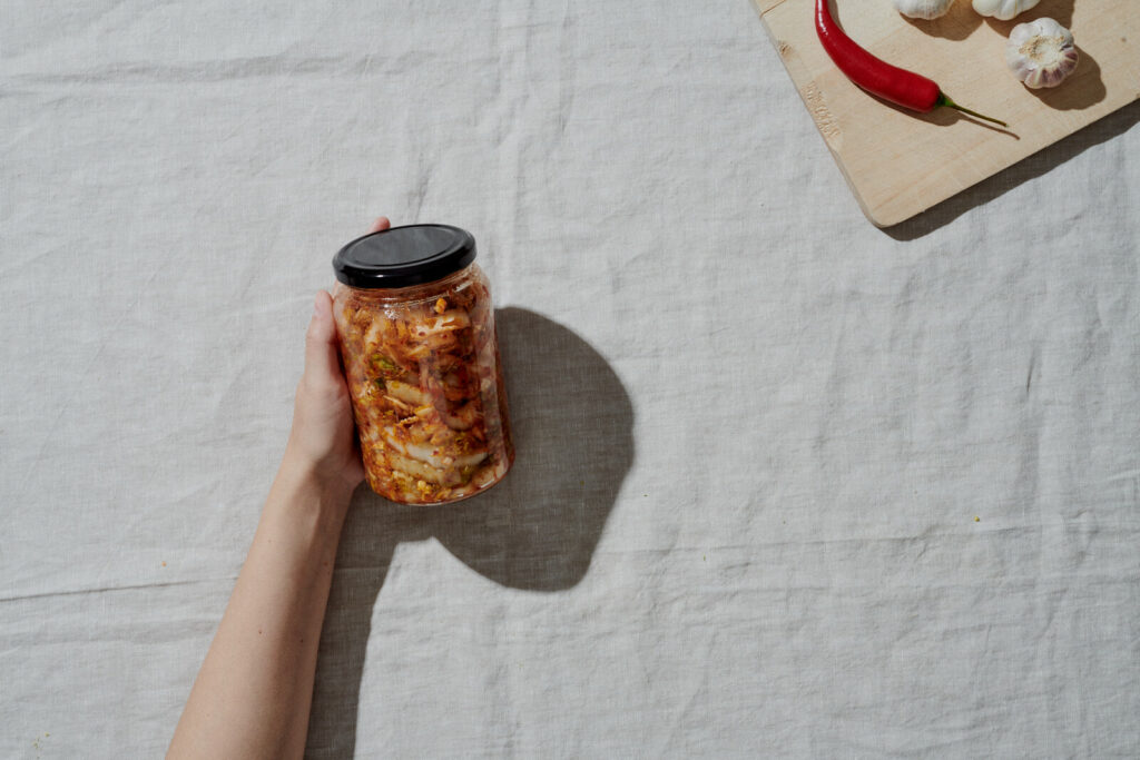 9.0 Fill your jars with your homemade Kimchi and place them in a cool, shaded area. Allow it to ferment for a day or two before indulging. I prefer enjoying it when it's fresh and vibrant. If you choose to let it age a bit more, transfer it to the refrigerator after a few days.