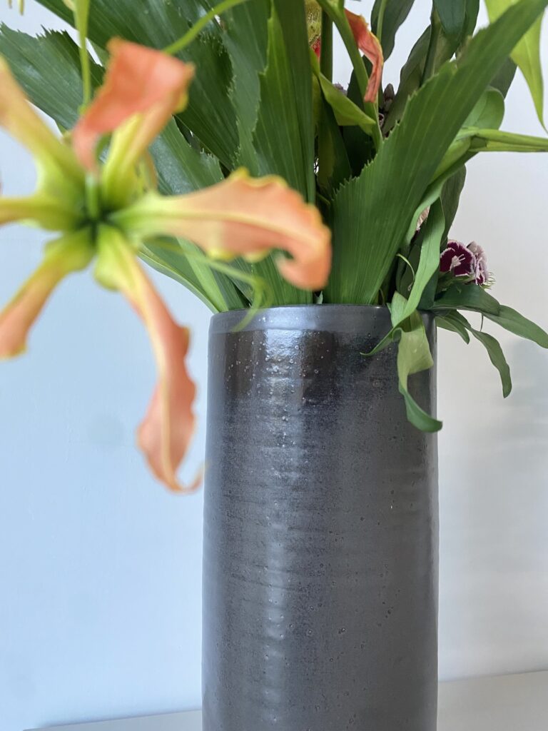 Nageirebana in a tall vase made of real stoneware ceramics in Black matte in Germany